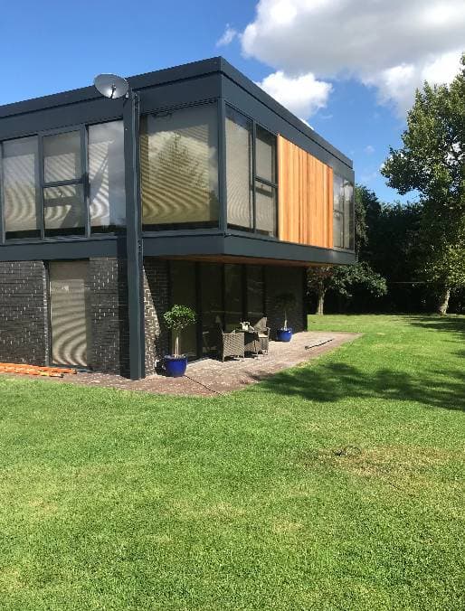 Hallway decorated with dark feature wall, Oxfordshire